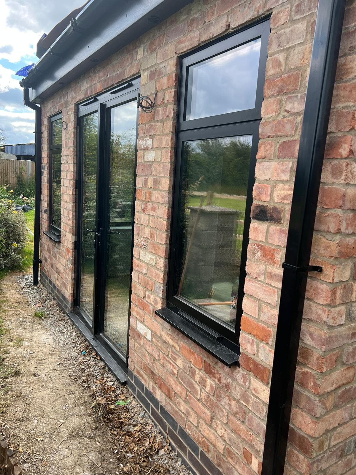 Brick extension with black aluminium windows