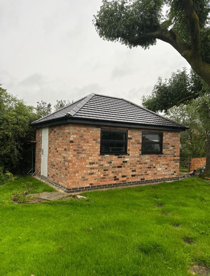 Brick outbuilding with hipped roof, side view
