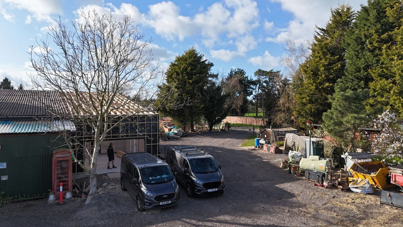 Aerial view of construction site with Scoop Contracts vans