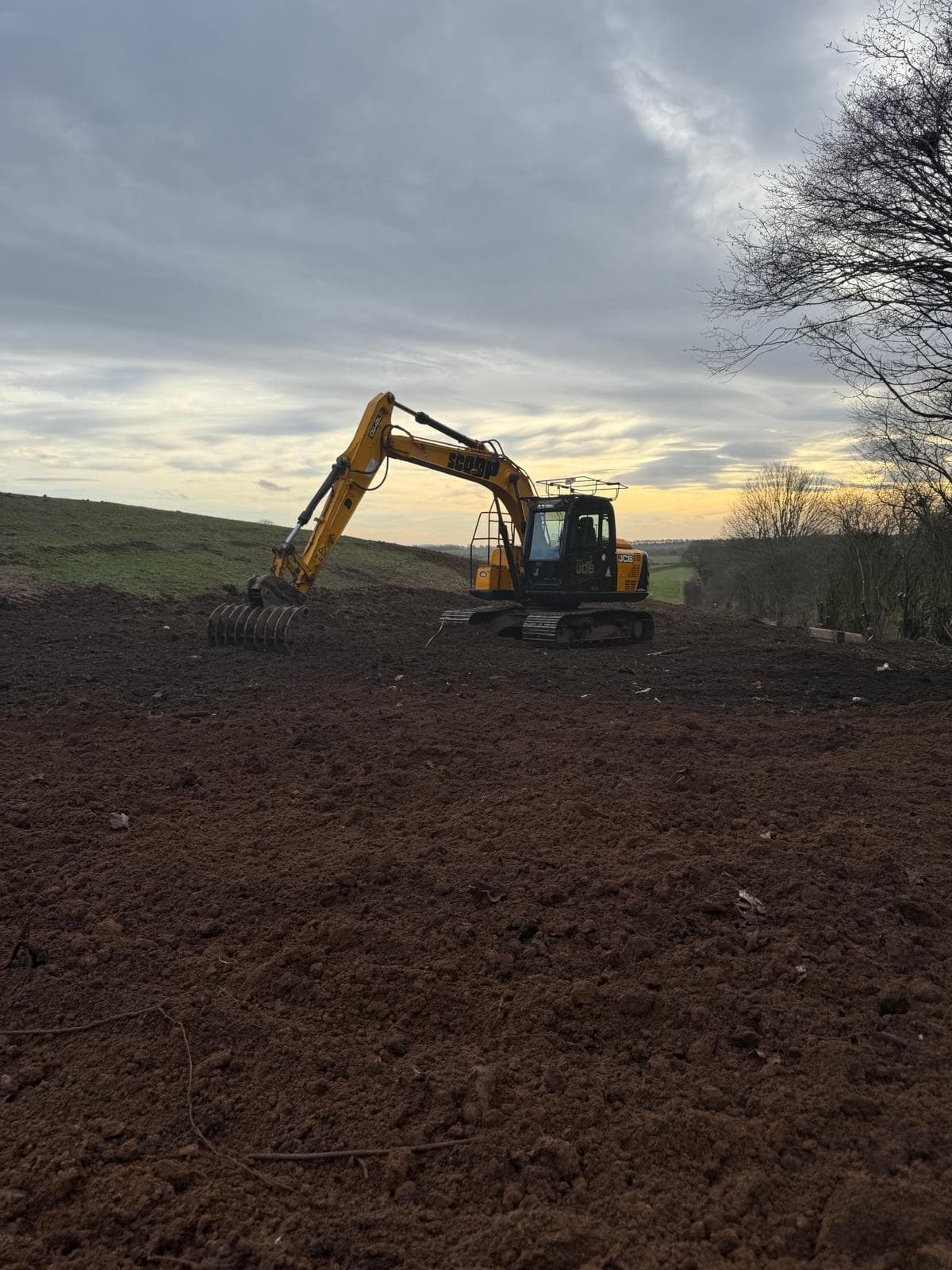 Field groundworks at sunset