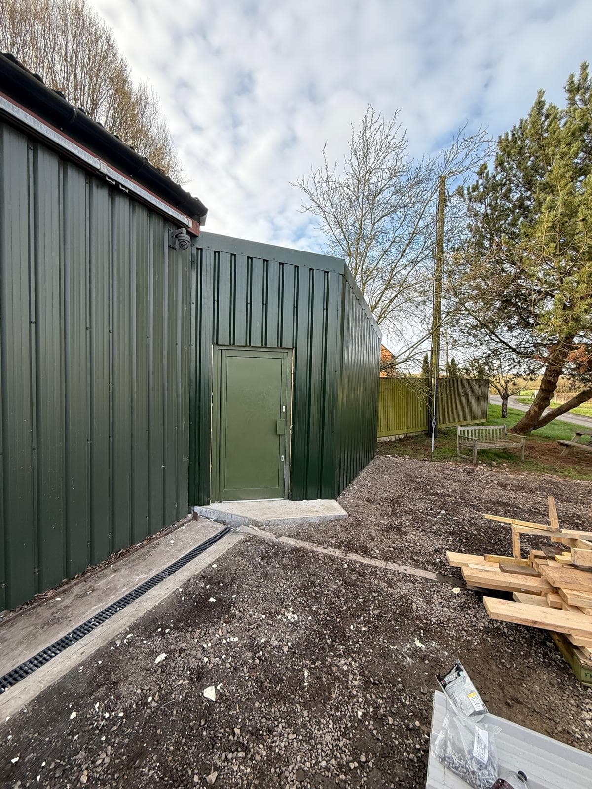 Green steel clad agricultural building, door detail