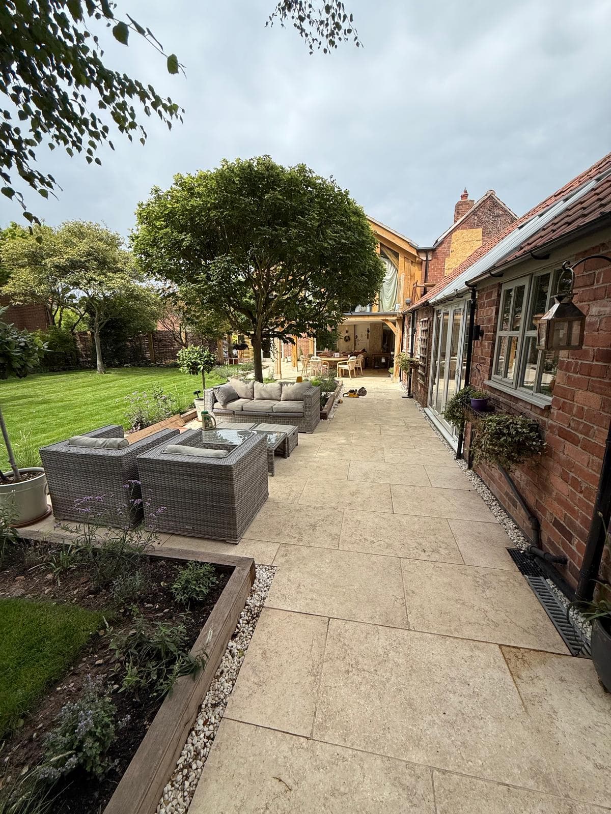 Completed oak frame extension with landscaped patio
